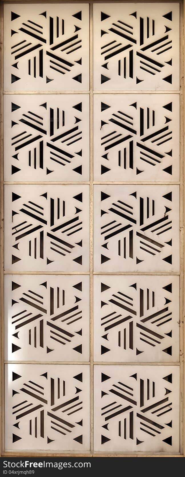 White wooden squares with triangular cuts, that create a pattern. White wooden squares with triangular cuts, that create a pattern