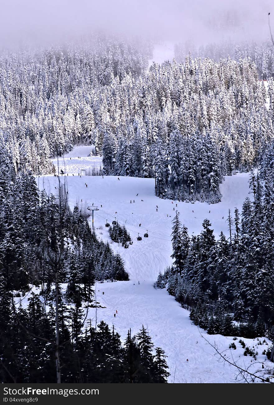 Ski mountain with skiers skiing at Canada. Ski mountain with skiers skiing at Canada