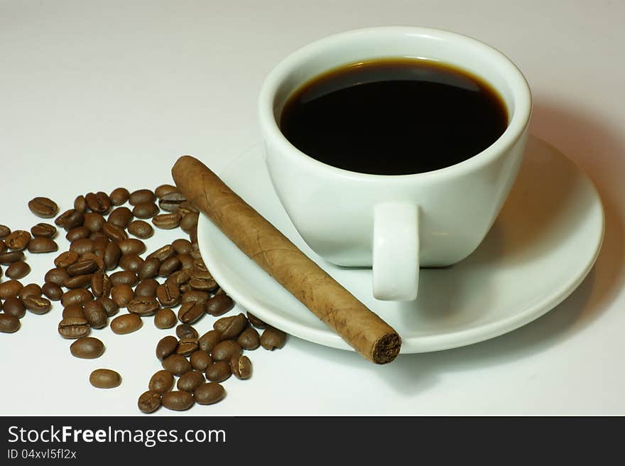 Cup of coffee and a cigar for relaxation. Cup of coffee and a cigar for relaxation