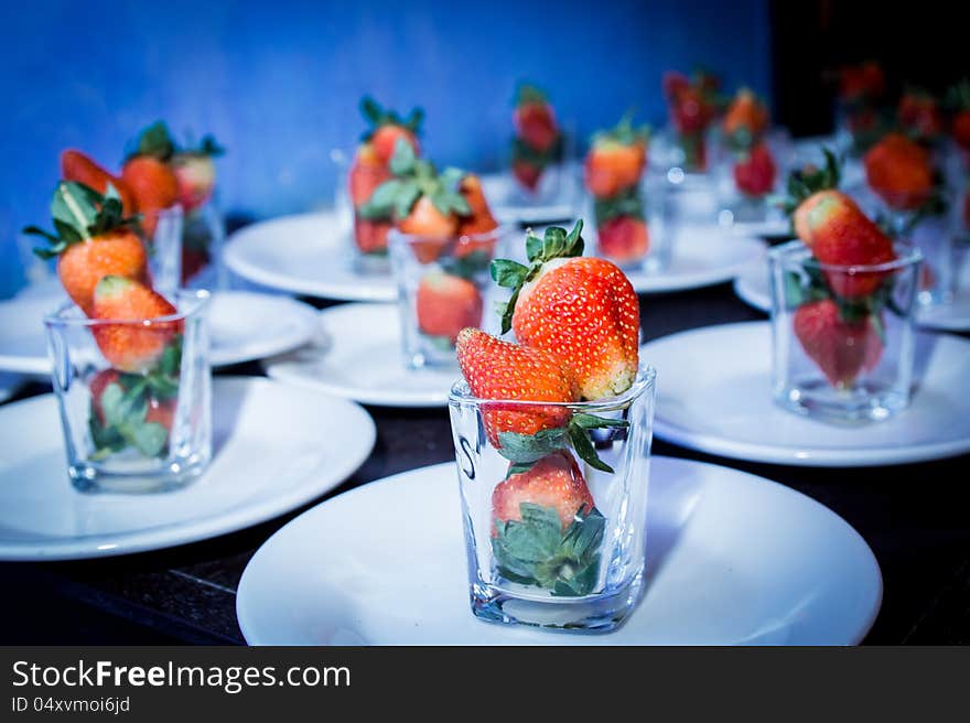 Food preparations with strawberry on glass