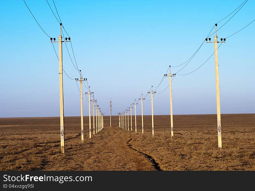 High-voltage columns background (it is photographed at sunset)