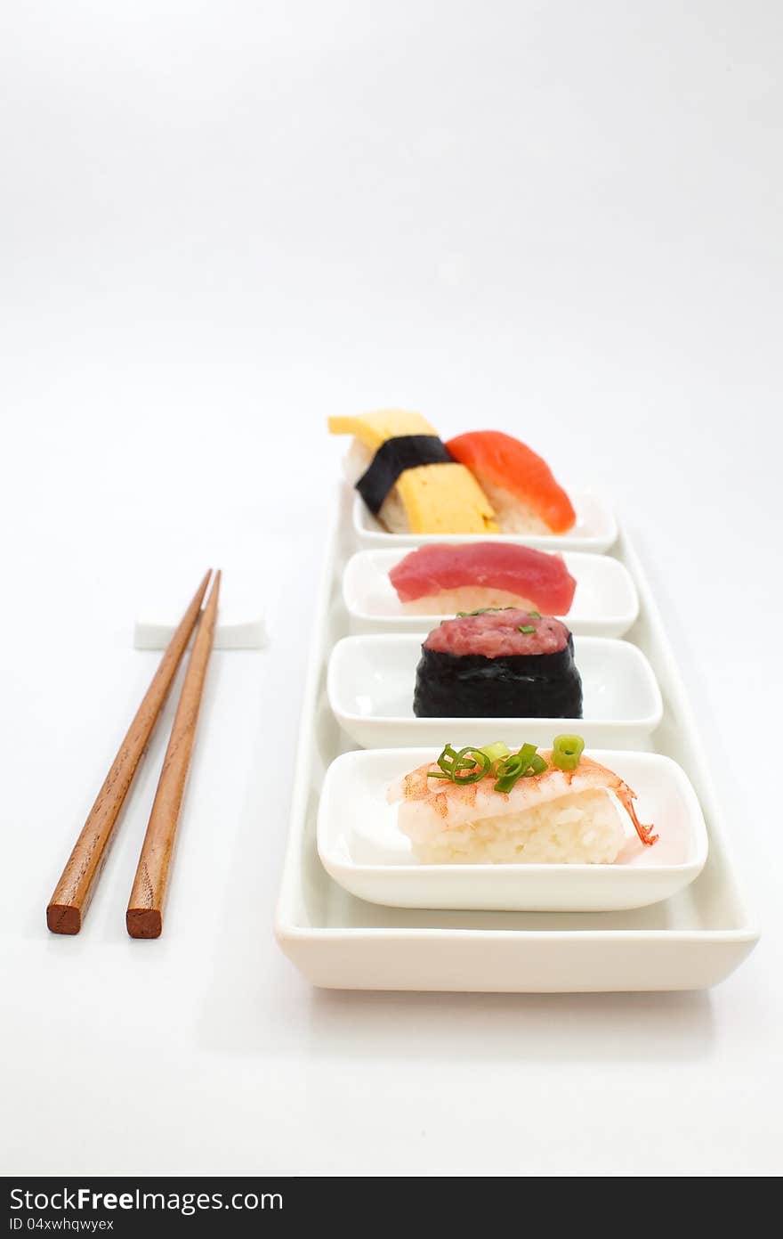 Sushi is a Japanese food consisting of cooked vinegared rice (shari) combined with other ingredients (neta), usually raw fish or other seafood. Sushi is a Japanese food consisting of cooked vinegared rice (shari) combined with other ingredients (neta), usually raw fish or other seafood.