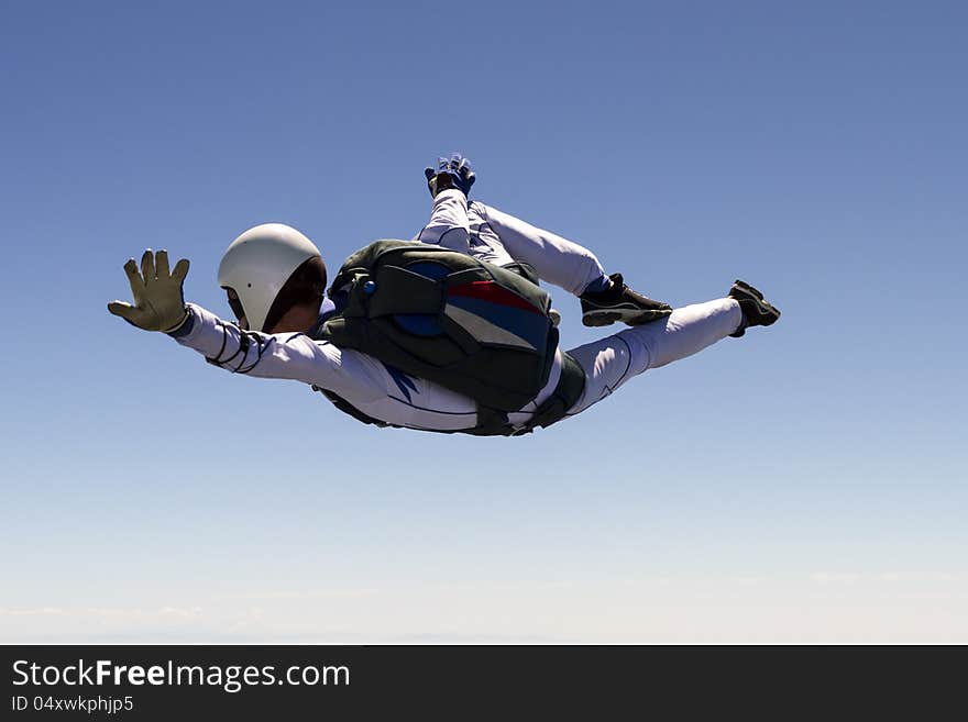 A girl performs in a free fall free style. A girl performs in a free fall free style.