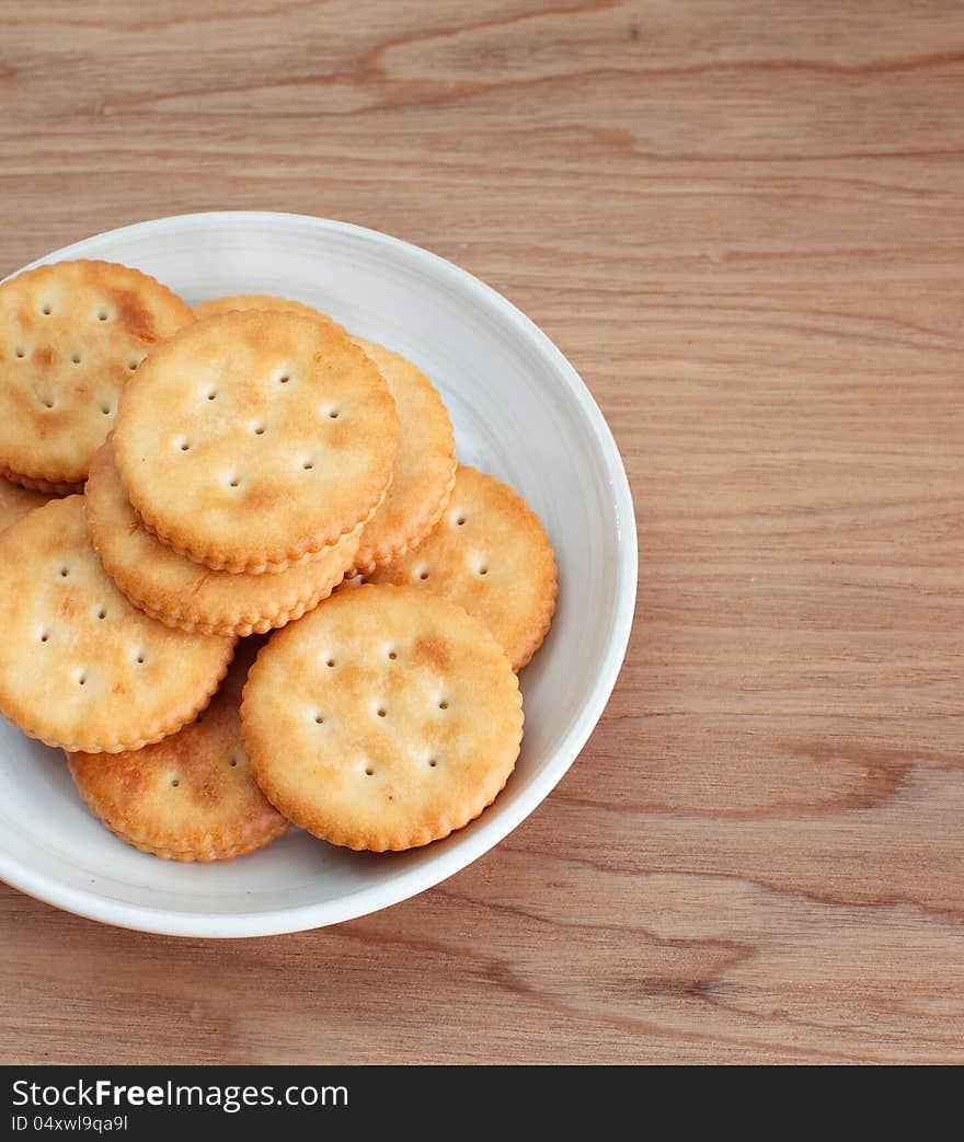 Closeup cracker on wooden plate