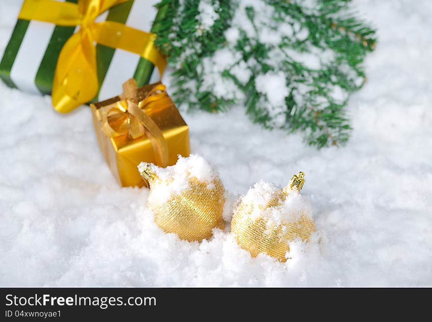 Golden Christmas decoration on snow. Golden Christmas decoration on snow