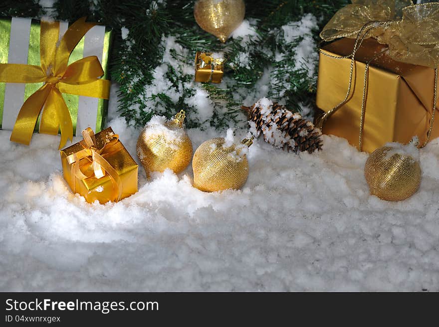 Golden Christmas decoration on snow. Golden Christmas decoration on snow