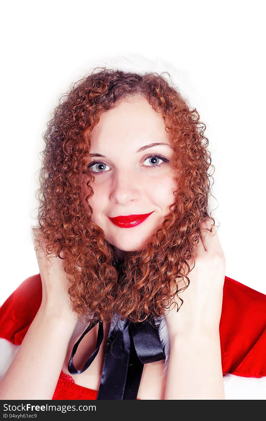 Portrait of pretty curly girl dressed as Santa