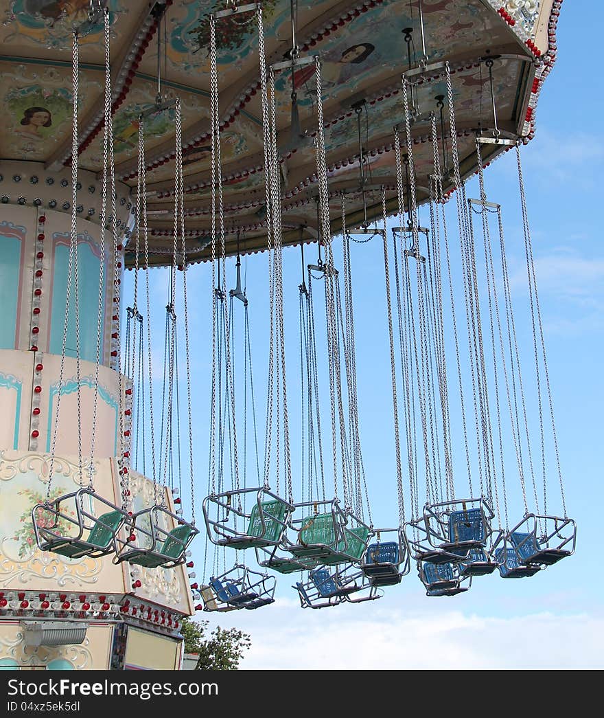 The Hanging Swing Seats of a Fun Fair Ride.