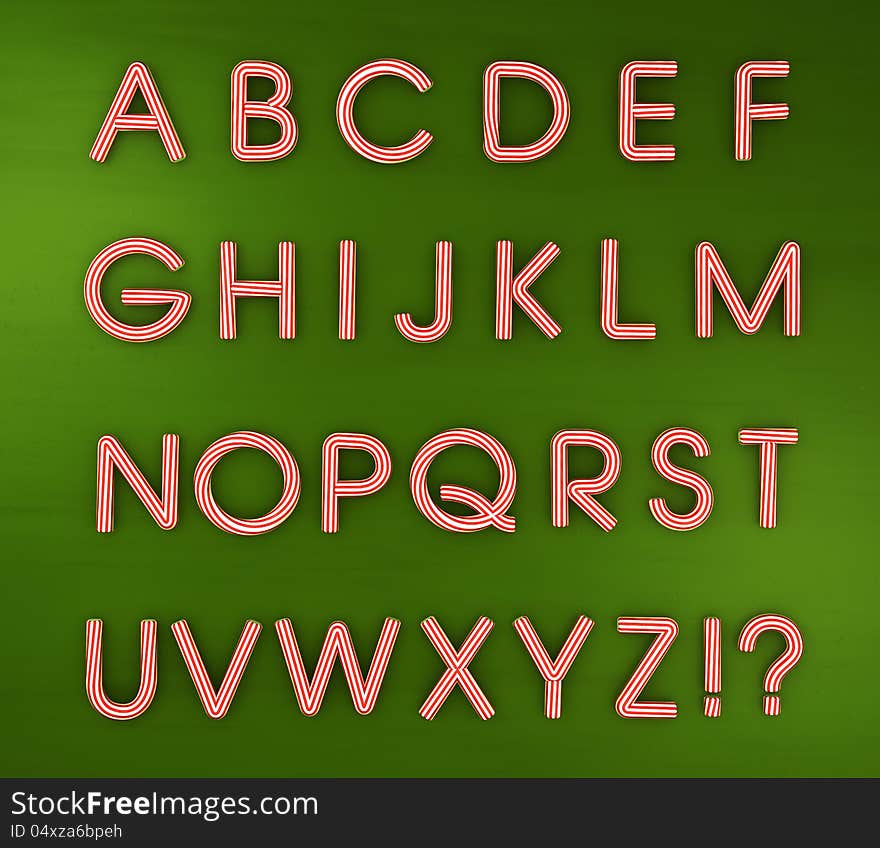 Candy cane Christmas alphabet isolated on green.