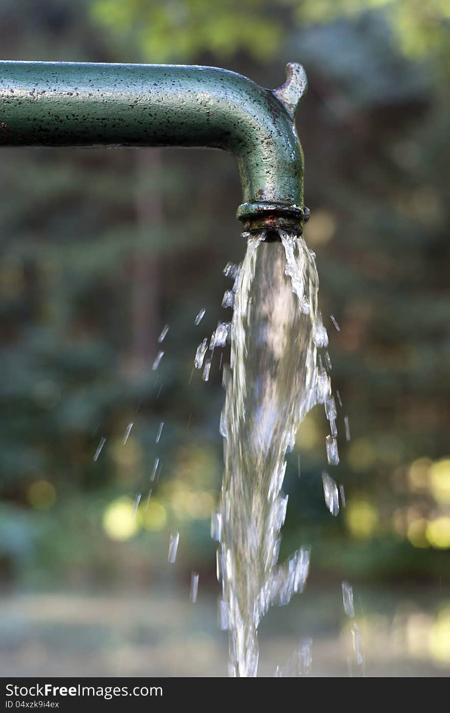 Drinking water running  from an old  water fountain.