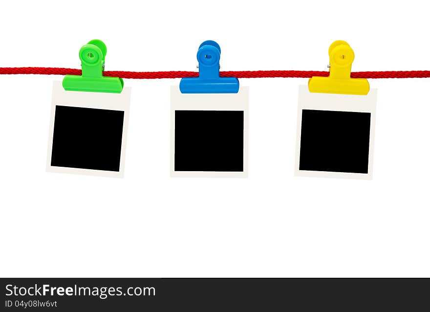 Blank photo frames Hanging by plastic peg on white background