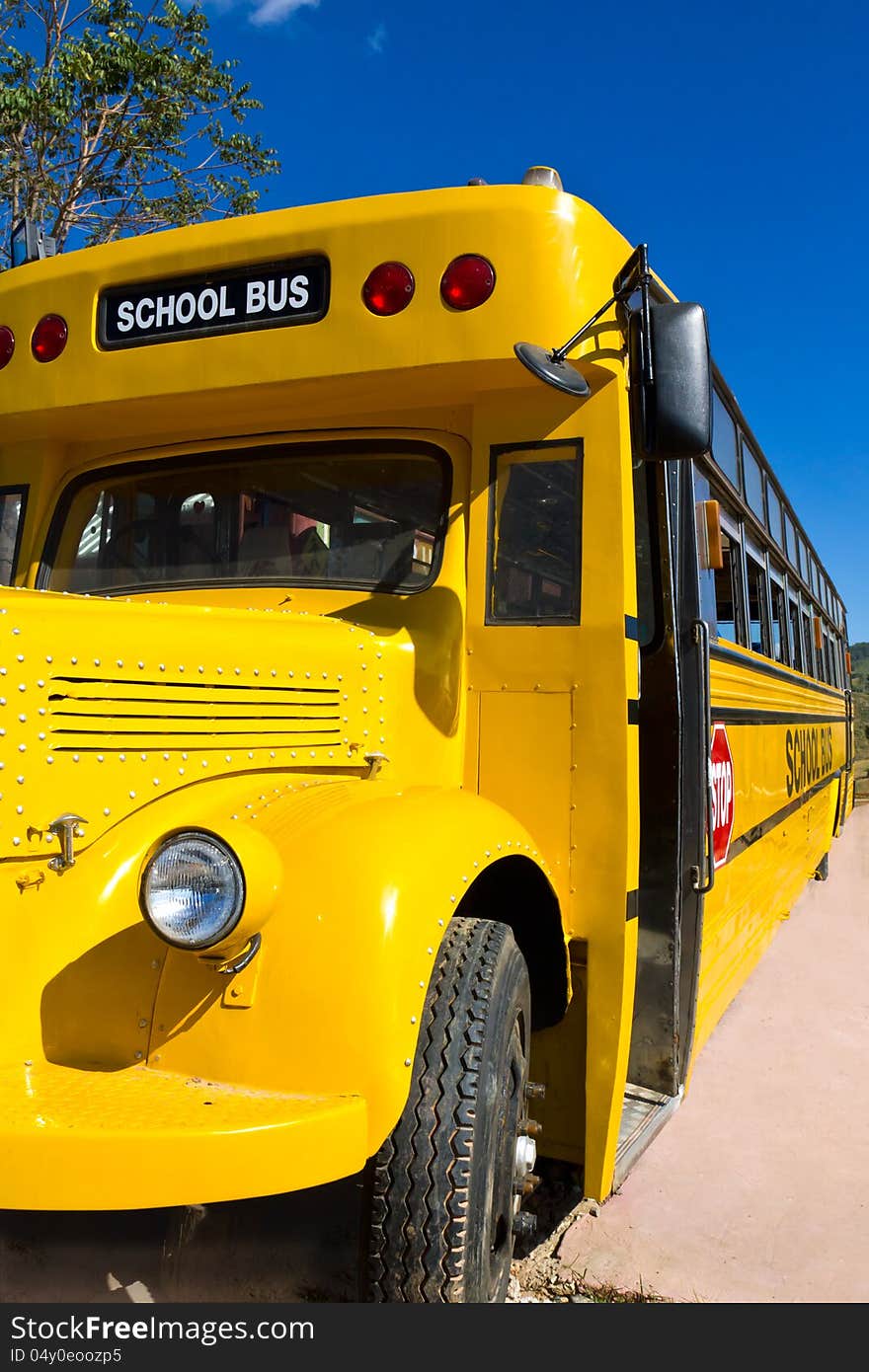 Front of Yellow School Bus with Blue Sky