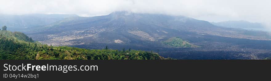 Panorama view of a mountainscape with low clouds. Panorama view of a mountainscape with low clouds