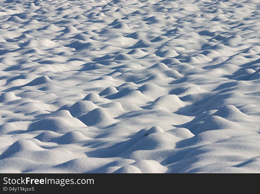 Dunes Of Snow In A Country Field