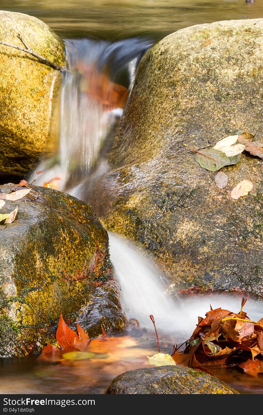 Beautiful veil cascading waterfall, mossy rocks