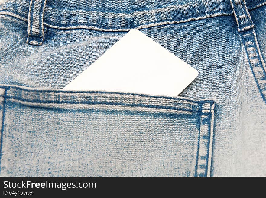 The business card form in a pocket of jeans