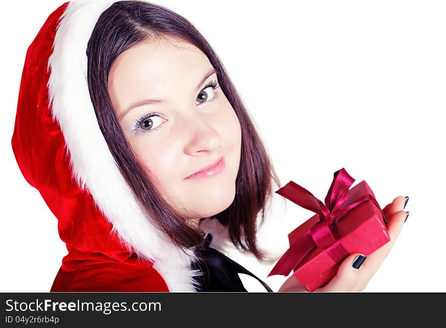 Pretty girl with a gift in Christmas isolated white background