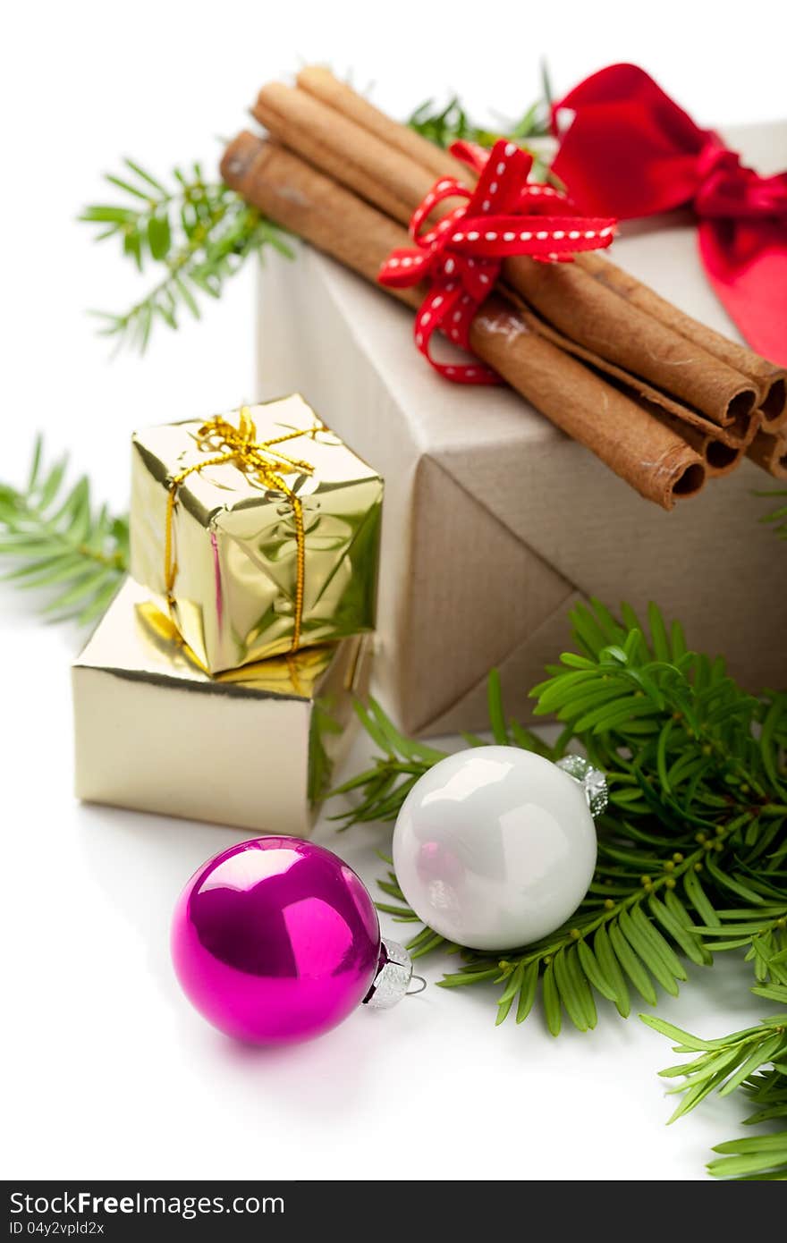 Christmas composition with baubles and gift boxes, on white