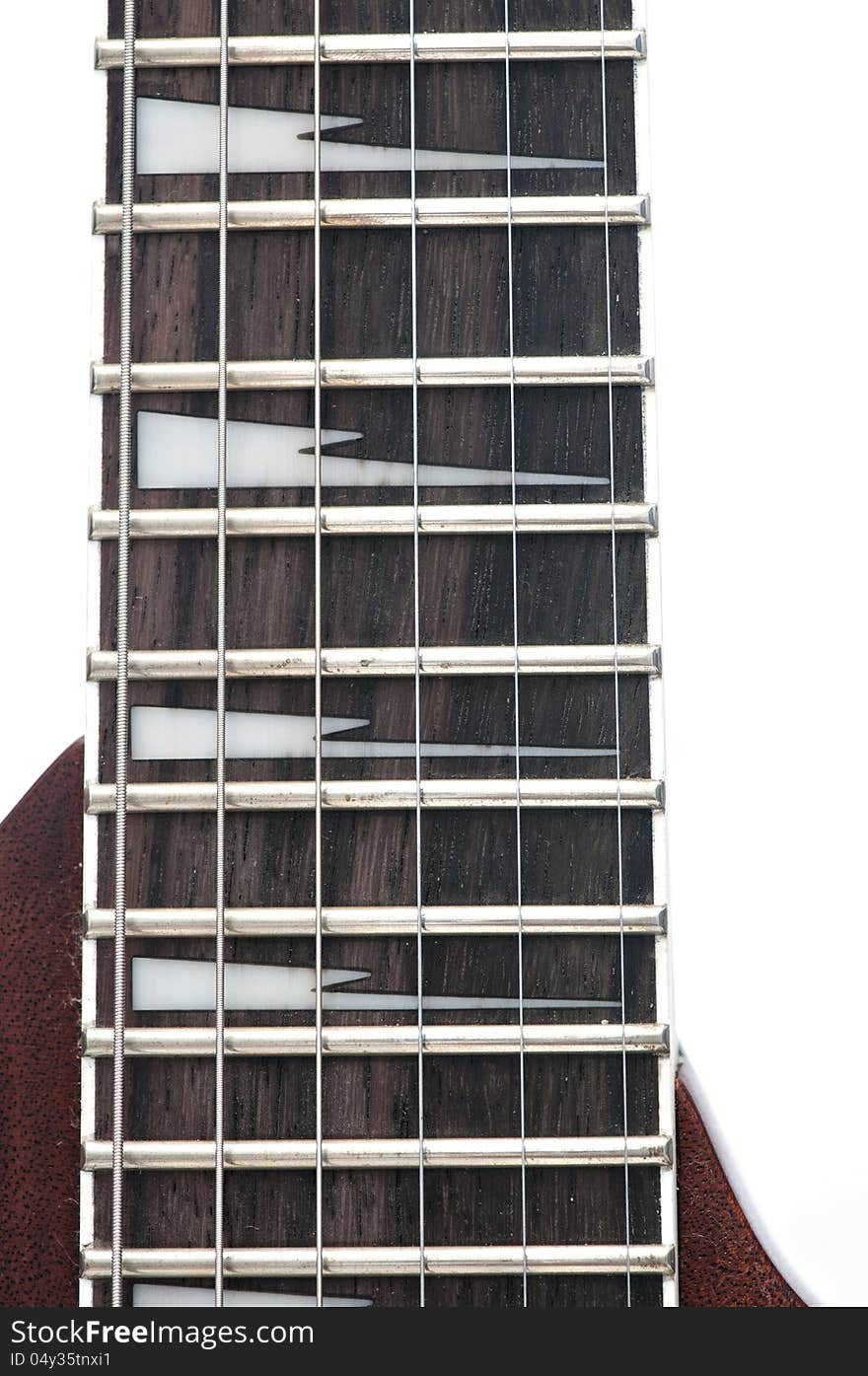 Electric guitar fingerboard with sharktooth inlay