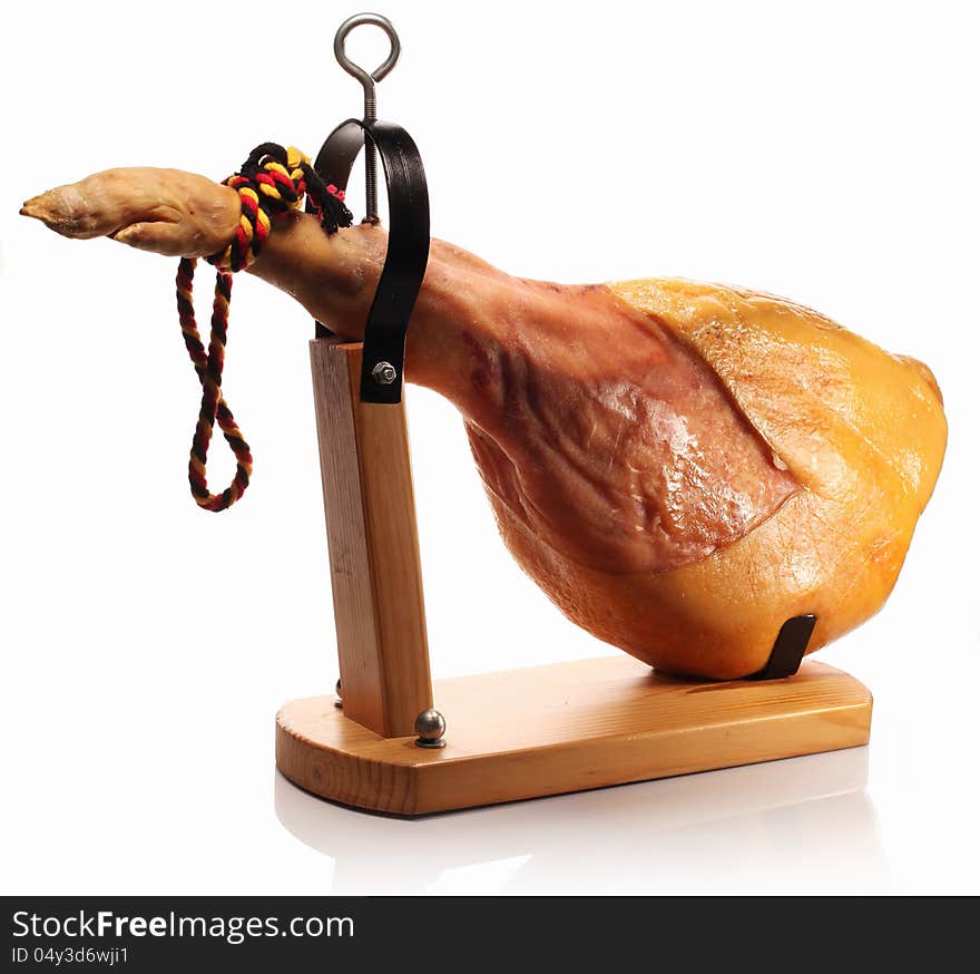 Ham on a wooden board on a white background. Ham on a wooden board on a white background.