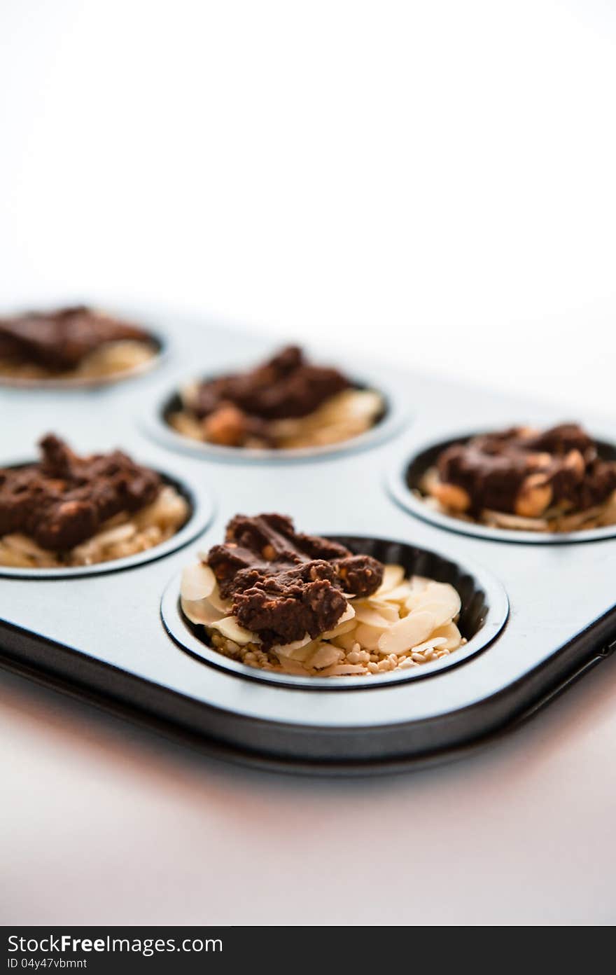 Tray of cookies with chocolate on top on the white background