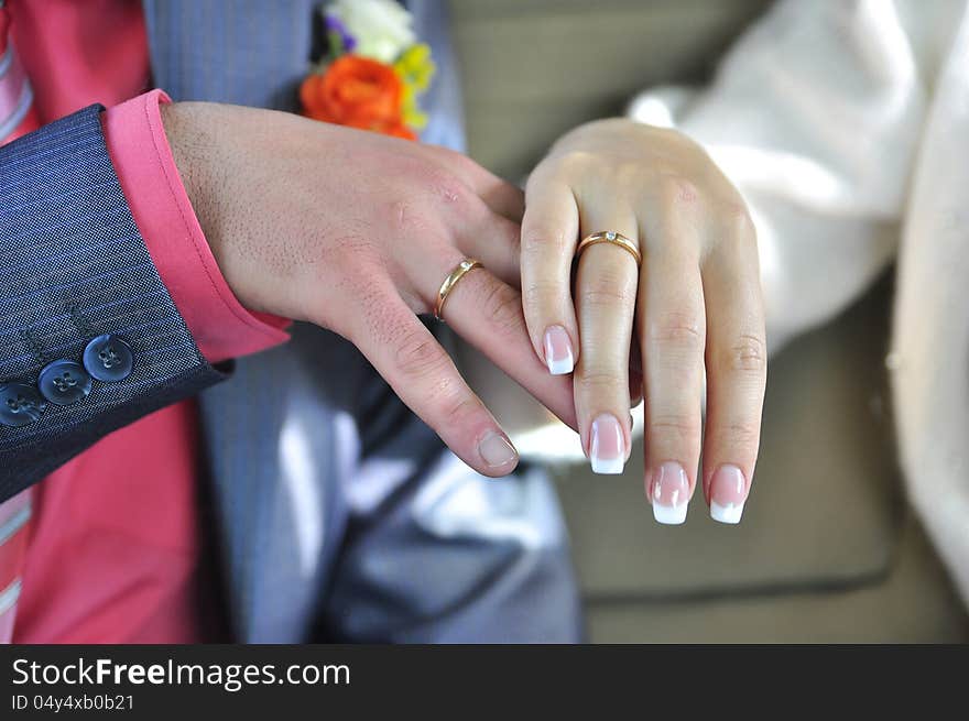 Wedding rings on the fingers of married