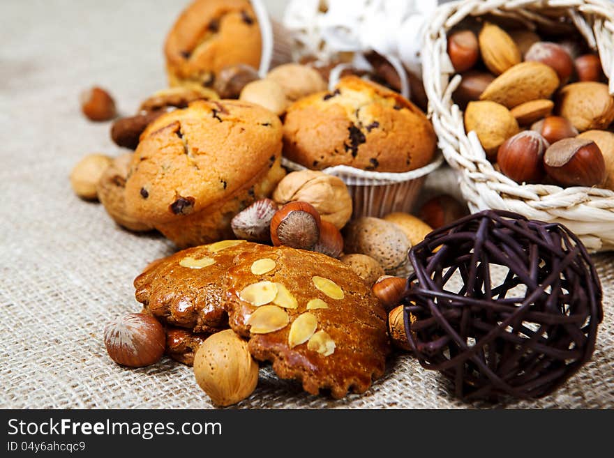 Fresh homemade pastry and nuts over coarse fabric