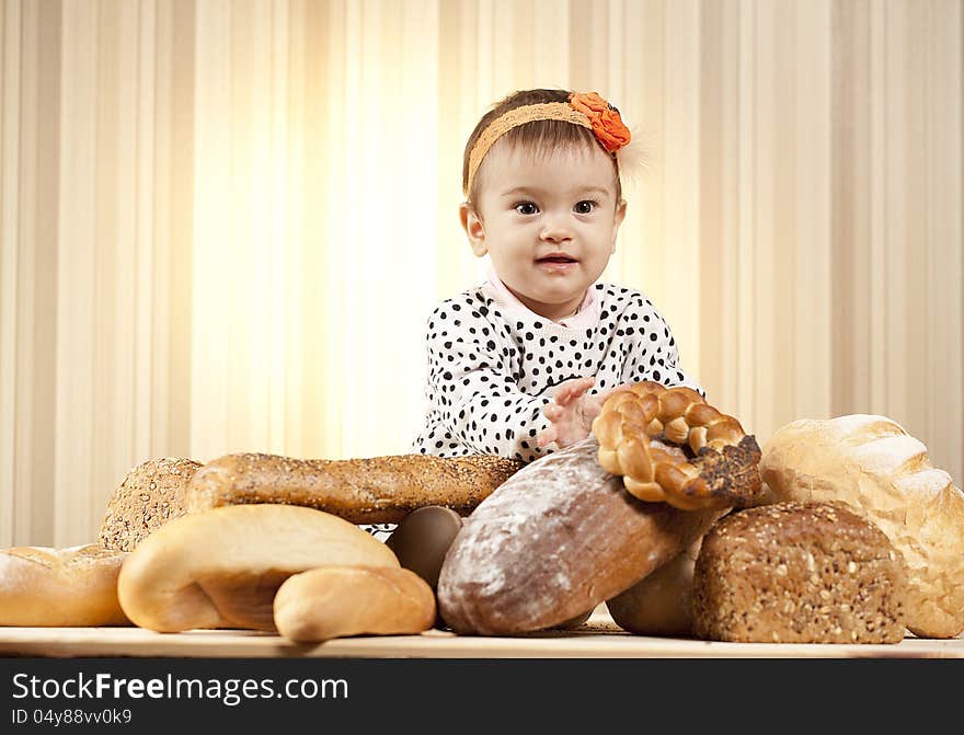 White infant choosing bread in studio. White infant choosing bread in studio