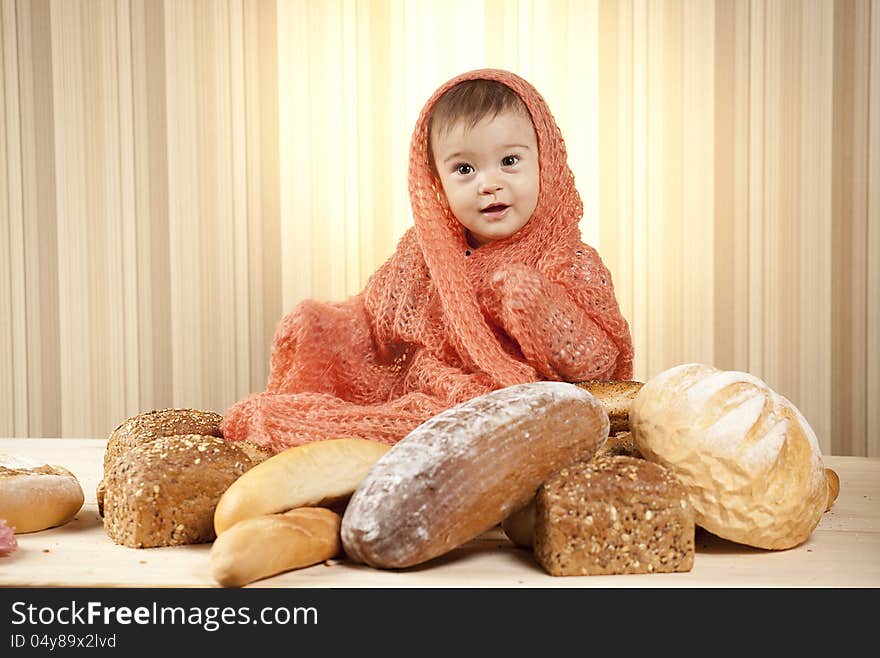 White infant choosing bread in studio. White infant choosing bread in studio