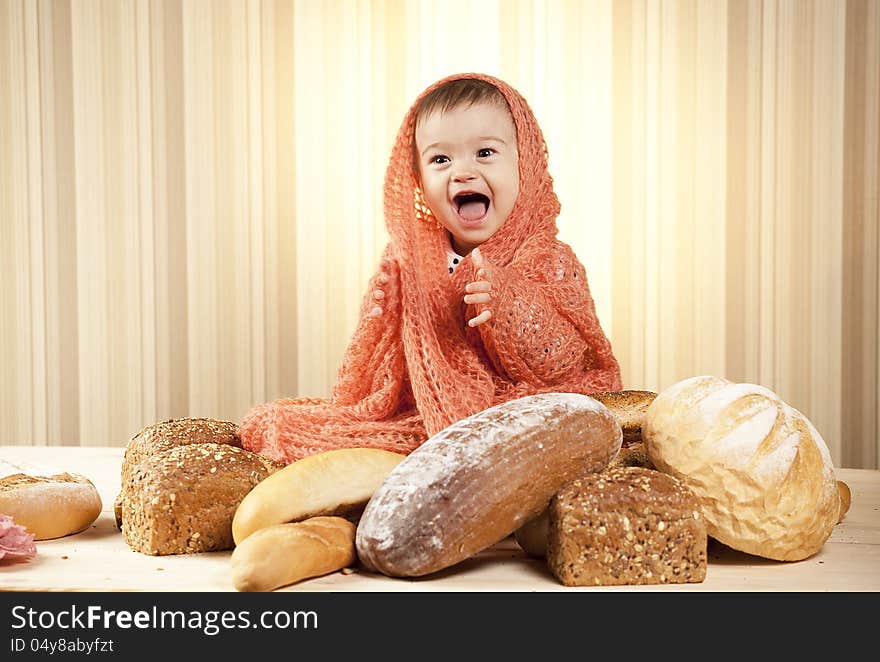 White infant choosing bread in studio. White infant choosing bread in studio