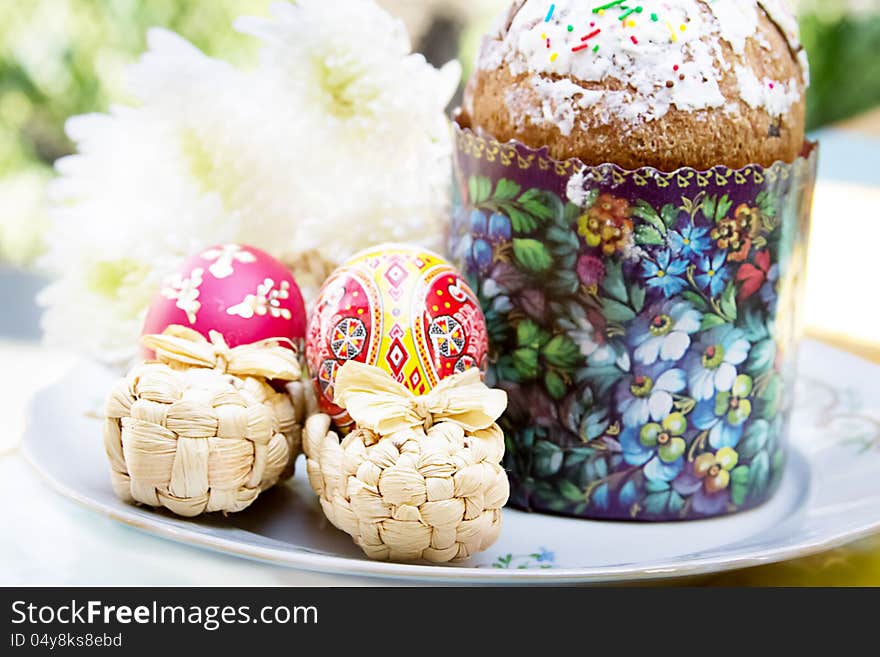 Easter cake with colorful eggs and flowers