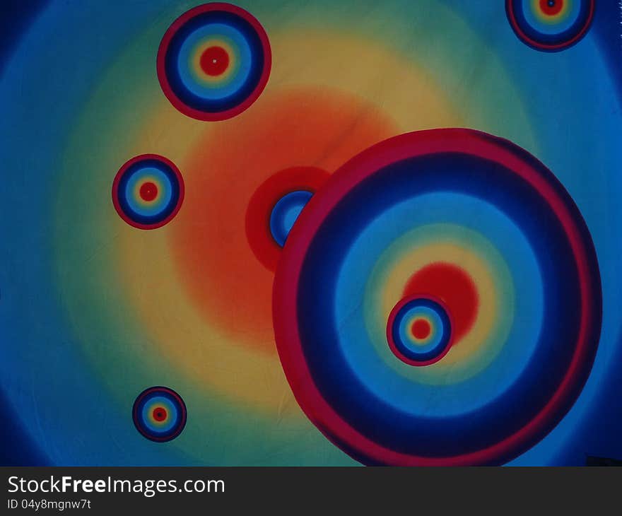 Concentric psychedelic circles on a piece of cloth. Concentric psychedelic circles on a piece of cloth.