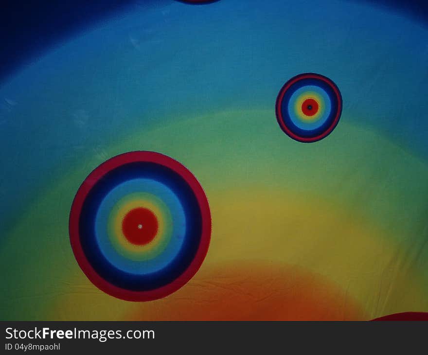 Concentric psychedelic circles on a piece of cloth. Concentric psychedelic circles on a piece of cloth.