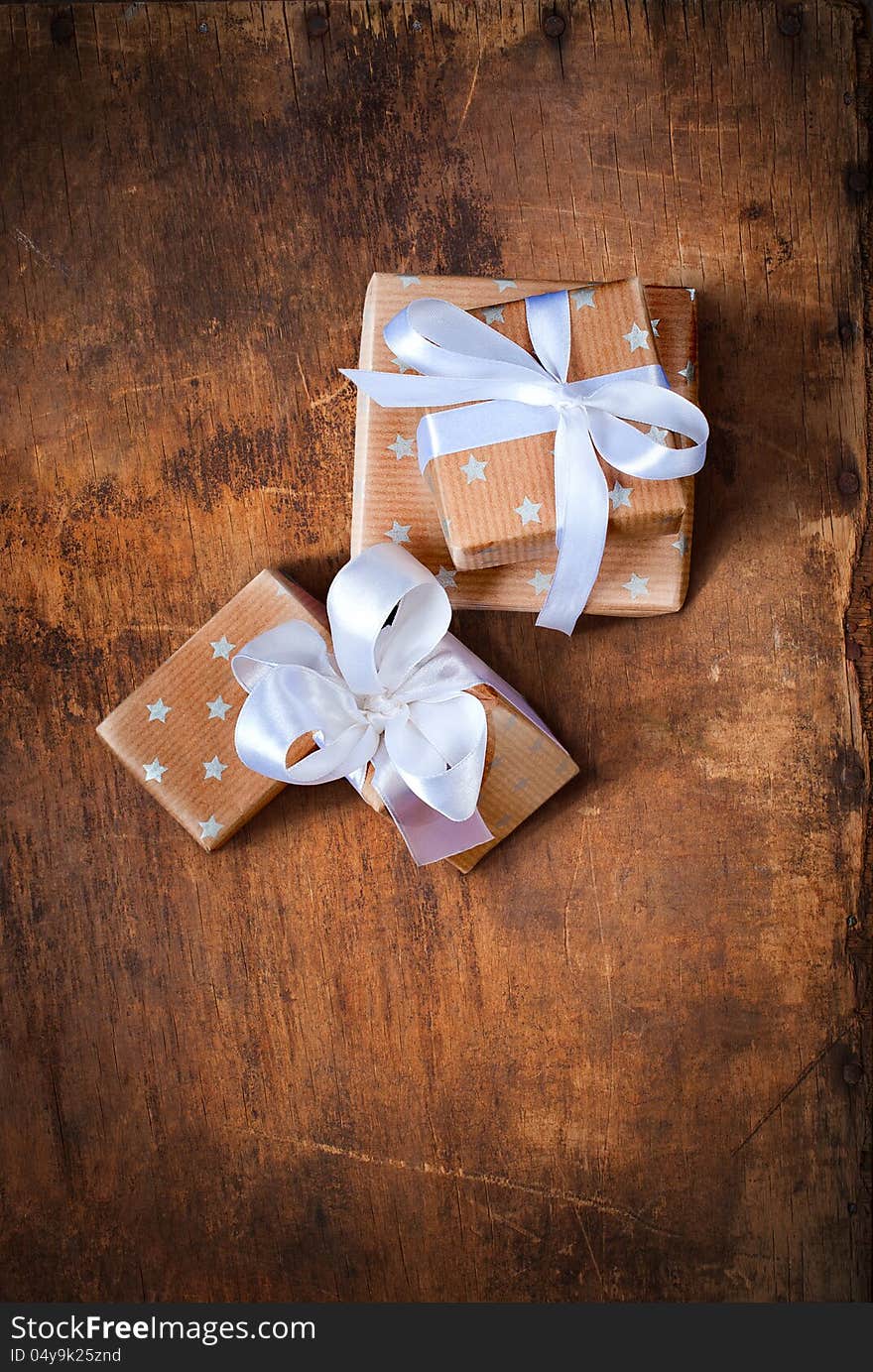 Christmas Boxes On A Wooden Surface