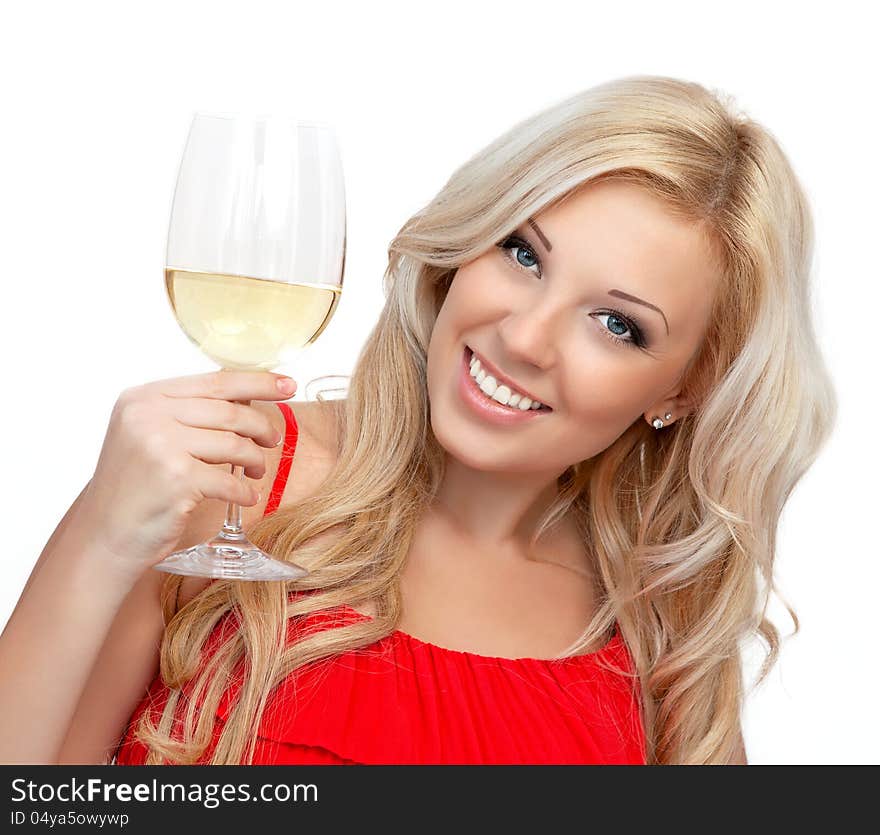 Portrait of a beautiful blonde girl in a red dress with a glass of wine for the holiday. Portrait of a beautiful blonde girl in a red dress with a glass of wine for the holiday