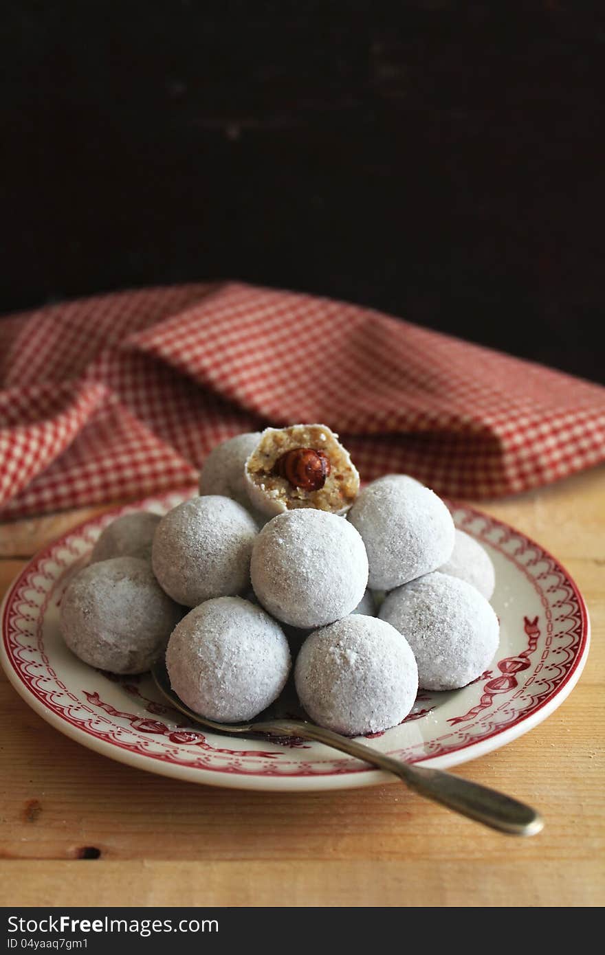 Creamy sweets with hazelnuts on plate