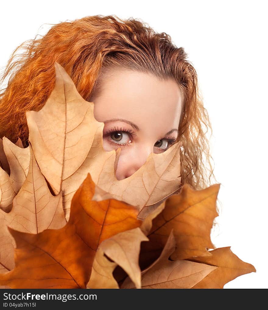 Redhead girl with dry autumn leaves. Redhead girl with dry autumn leaves