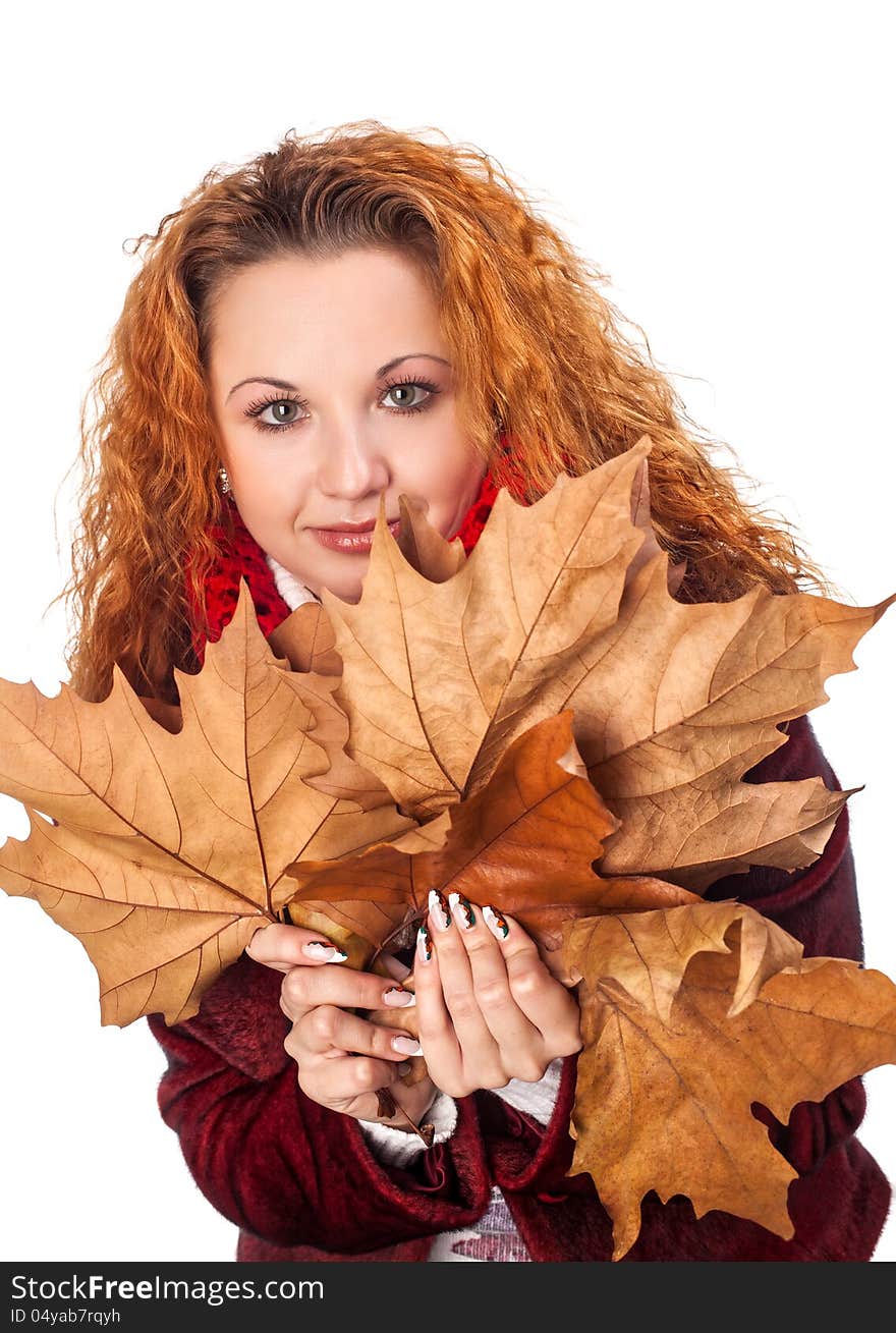 Redhead girl with dry autumn leaves. Redhead girl with dry autumn leaves