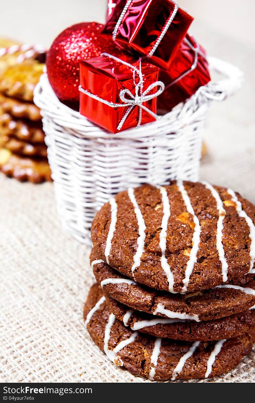 Christmas cookies with small gift boxes in a basket