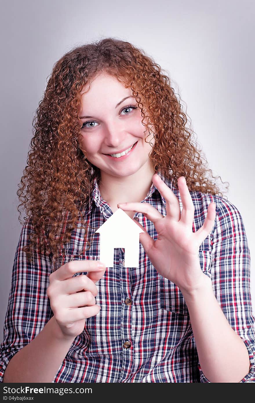 Pretty curly girl builder with their dream house