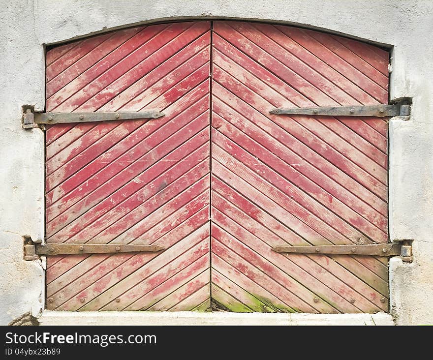 Wooden door with forged curtain