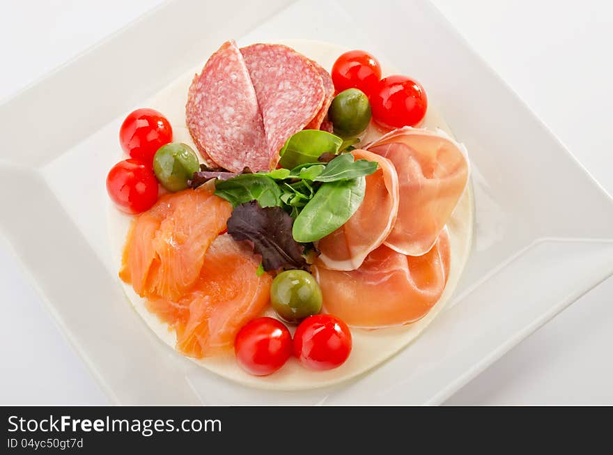 Mixed appetizer on mozzarella bed