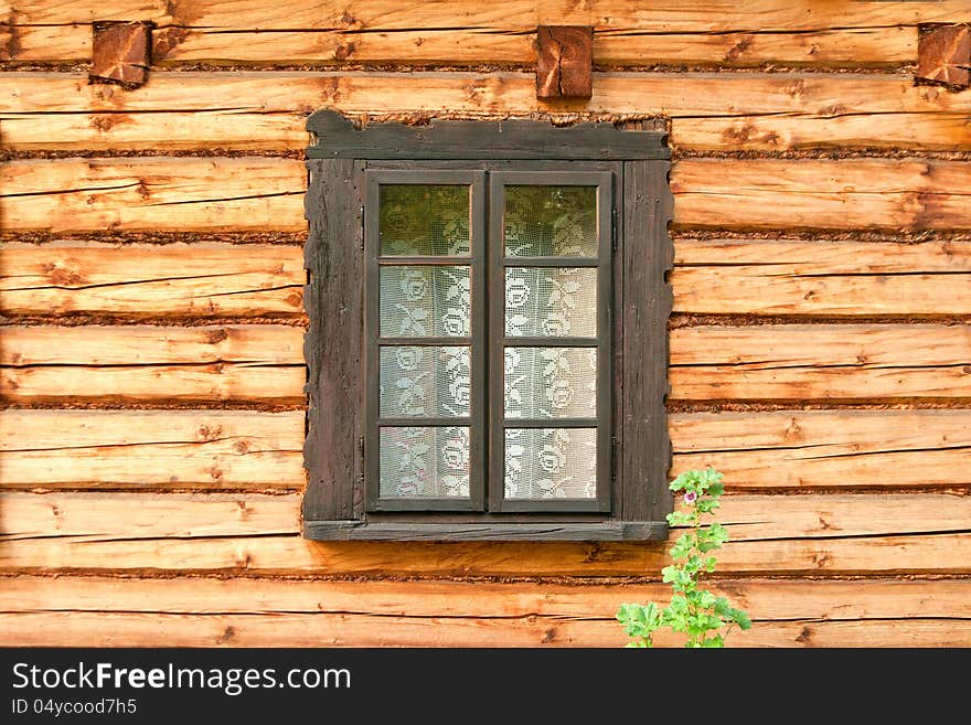 Window of a old wooden cottage. Retro style.