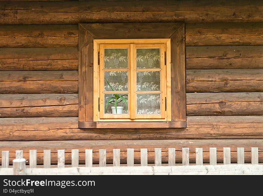 Window of a old wooden cottage. Retro style.