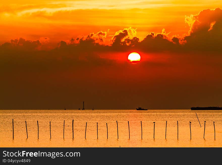 Sea sunset with boat transports