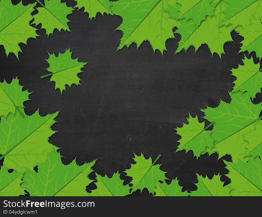 Blackboard with green maple leaves