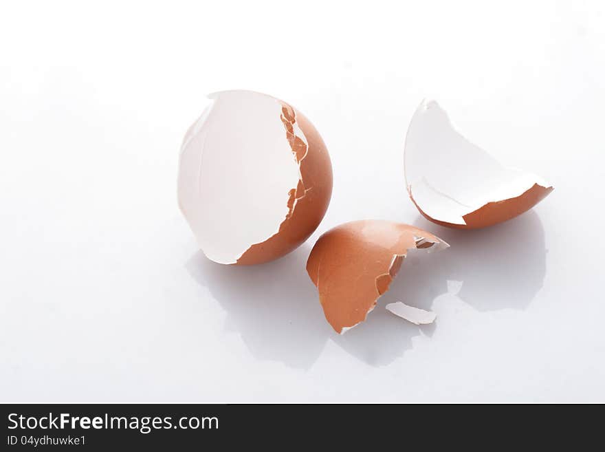 Broken chicken egg on white background. Broken chicken egg on white background