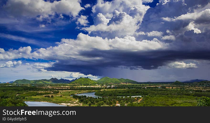 Landscape of pranburi river with dark grey clouds