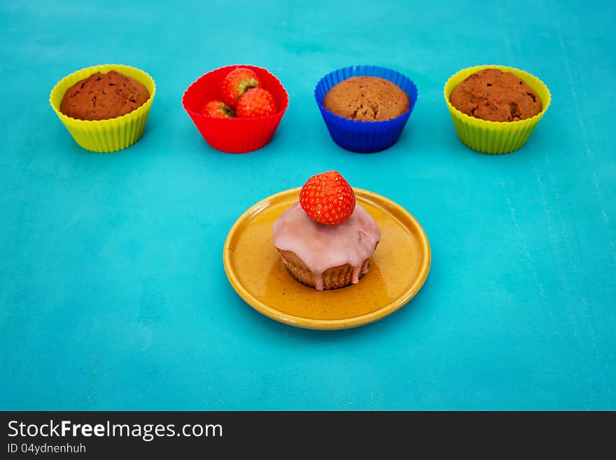 Different cupcakes with strawberry, multicolored. Different cupcakes with strawberry, multicolored