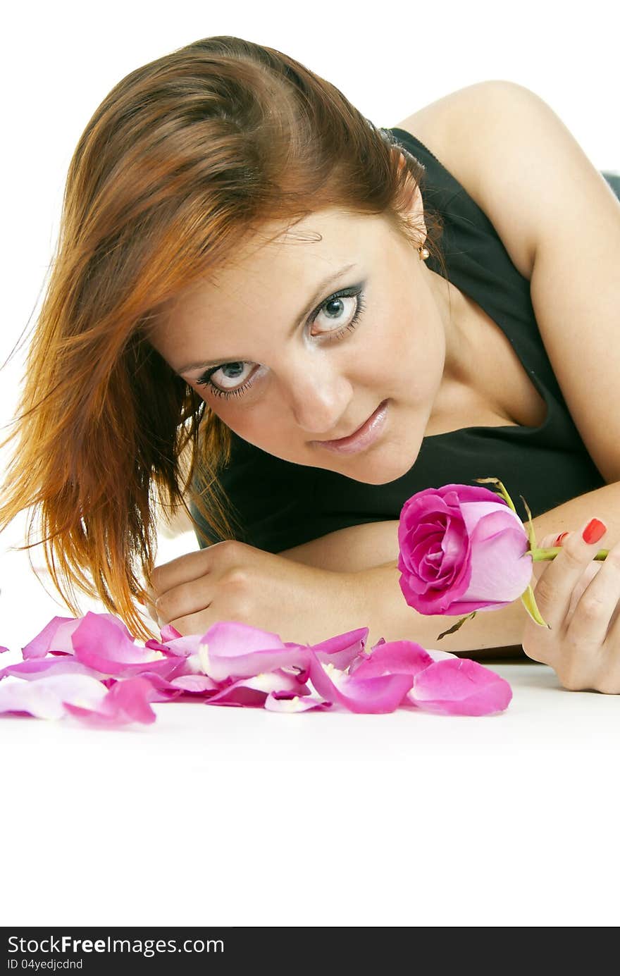 Beautiful girl with a rose and petals. Beautiful girl with a rose and petals